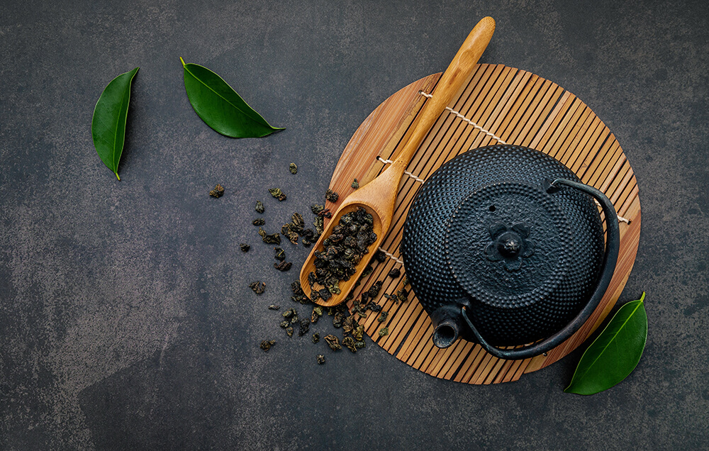 Vecteezy Black Cast Iron Tea Pot With Herbal Tea Set Up On A Dark Stone Background 2225552 Copy